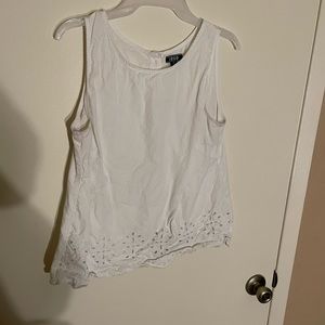 White tank top with key holes along the bottom
